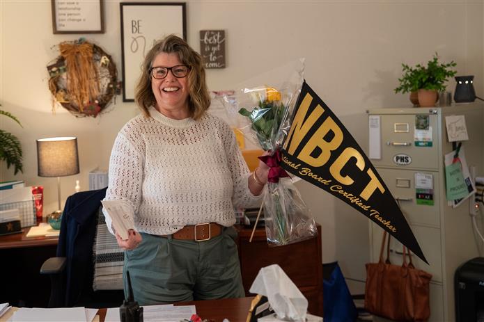  An image of Cynthia James from Perry High School with her NBCT pennant